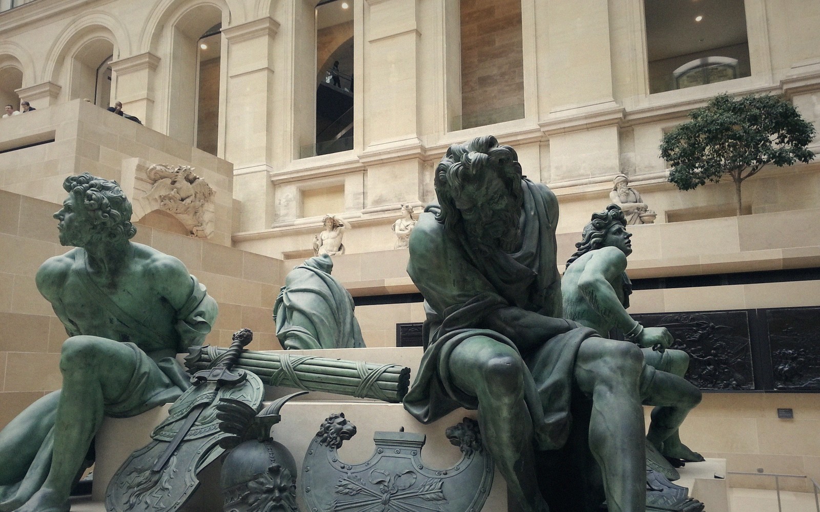 A sculpture gallery of standing figures on plinths