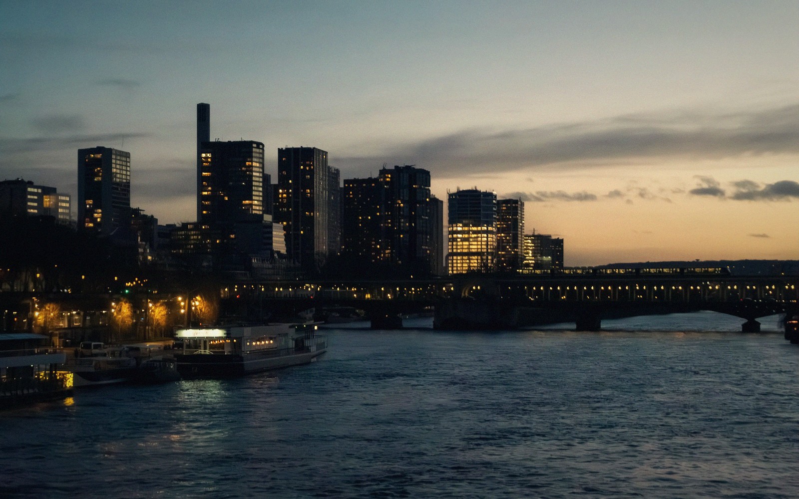 The Tour Montparnasse rising over the Paris rooftops at dusk
